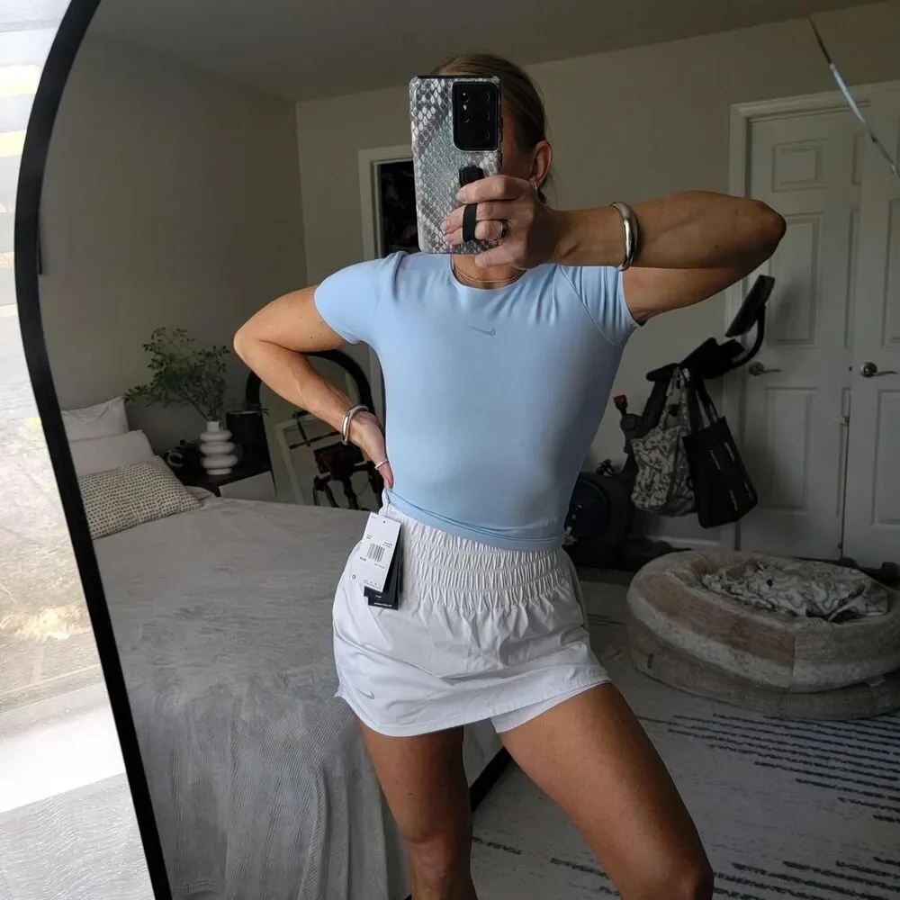 NWT NIKE FORM women's training top in baby blue, size xxs.